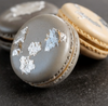 Macarons decorated with edible silver leaf