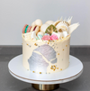 Celebration cake decorated with edible silver leaf
